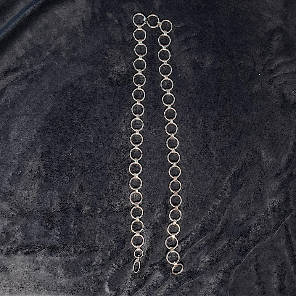 A silver chain belt.